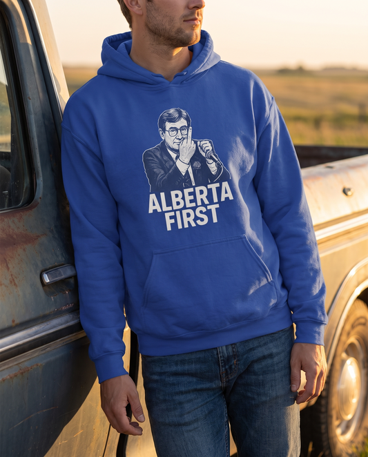 Man wearing Alberta First The Gesture cobalt oversized hoodie by pickup truck golden hour