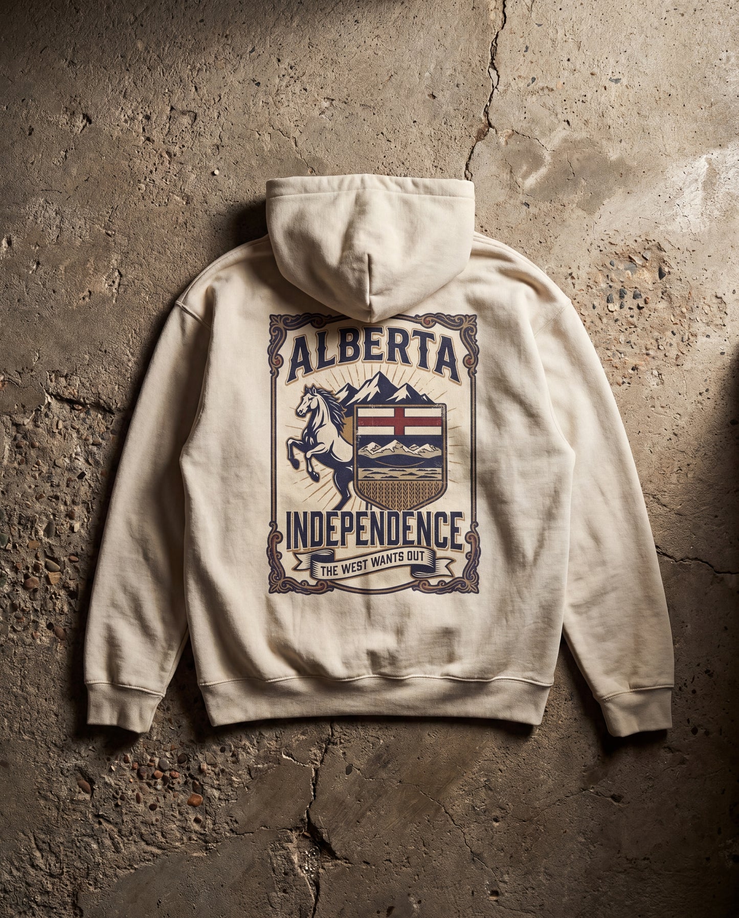 Beige hoodie with 'Alberta Independence' graphic on a textured stone wall