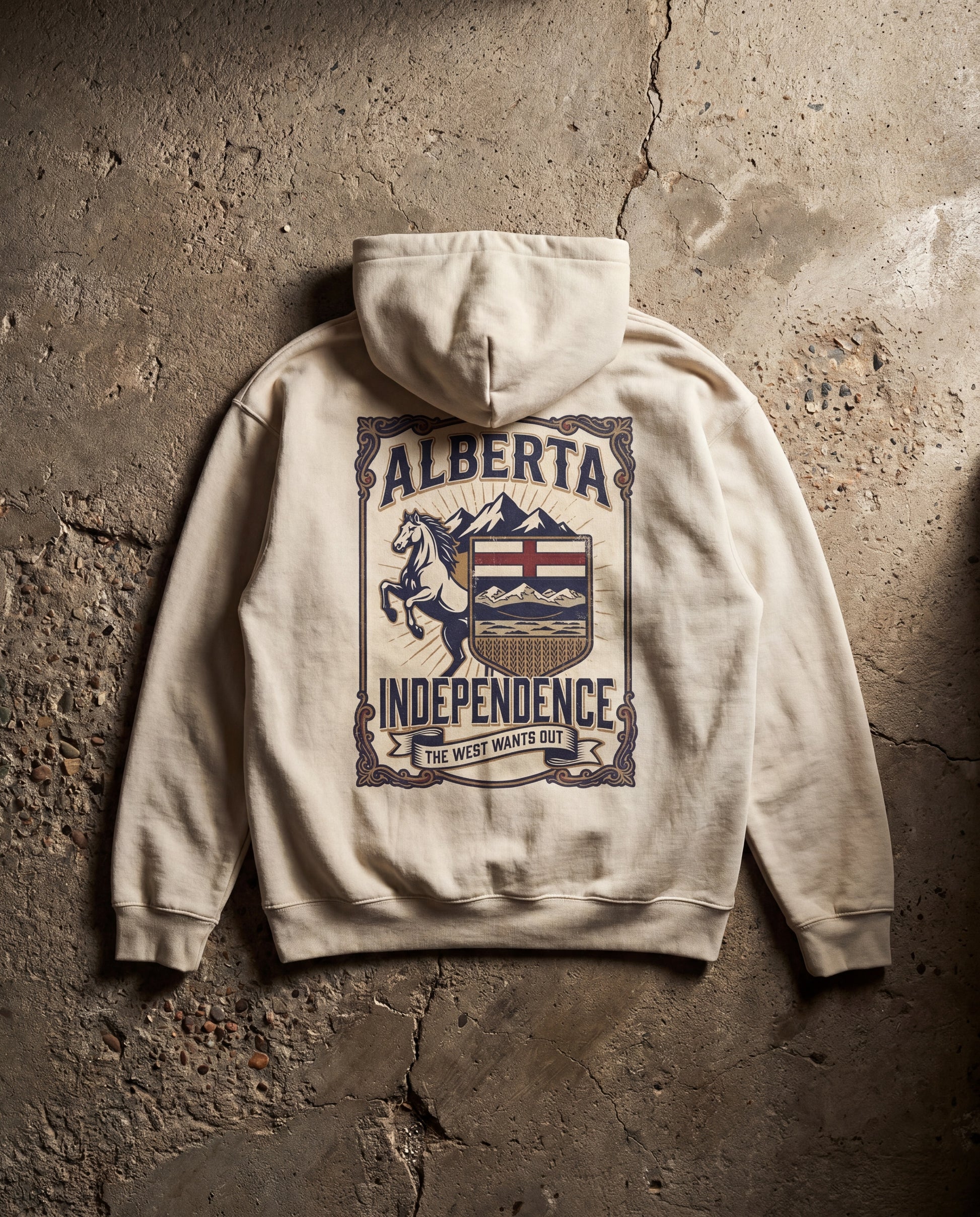 Beige hoodie with 'Alberta Independence' graphic on a textured stone wall