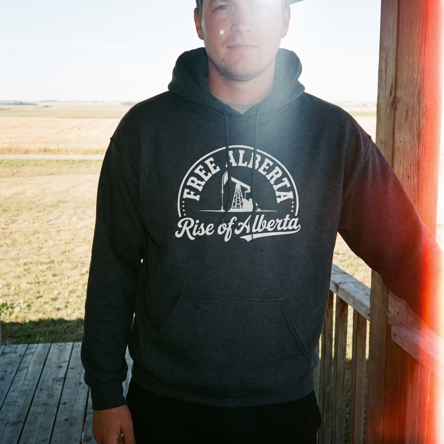Free Alberta hoodie dark heather porch lifestyle