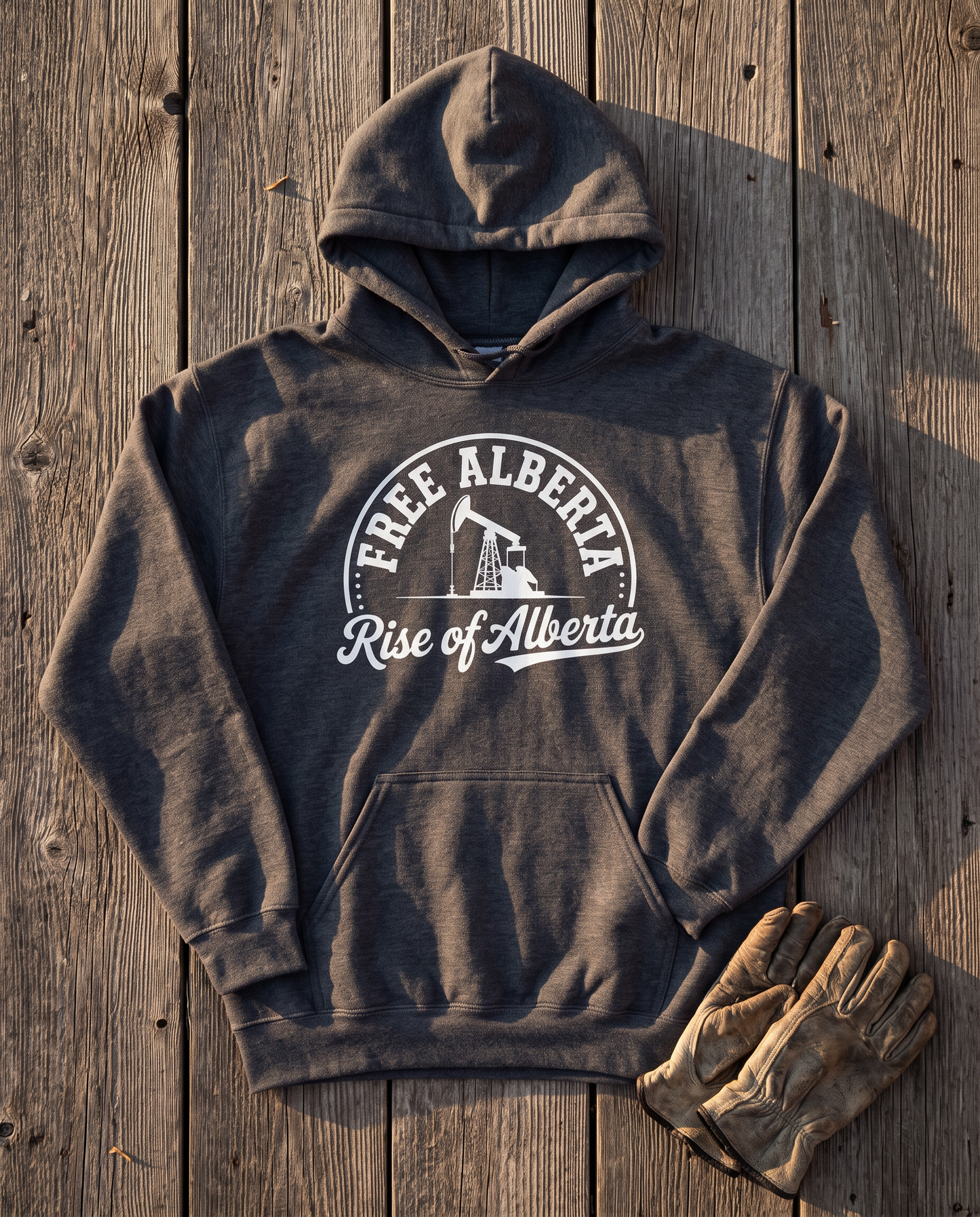 Free Alberta hoodie dark heather flat lay barn wood