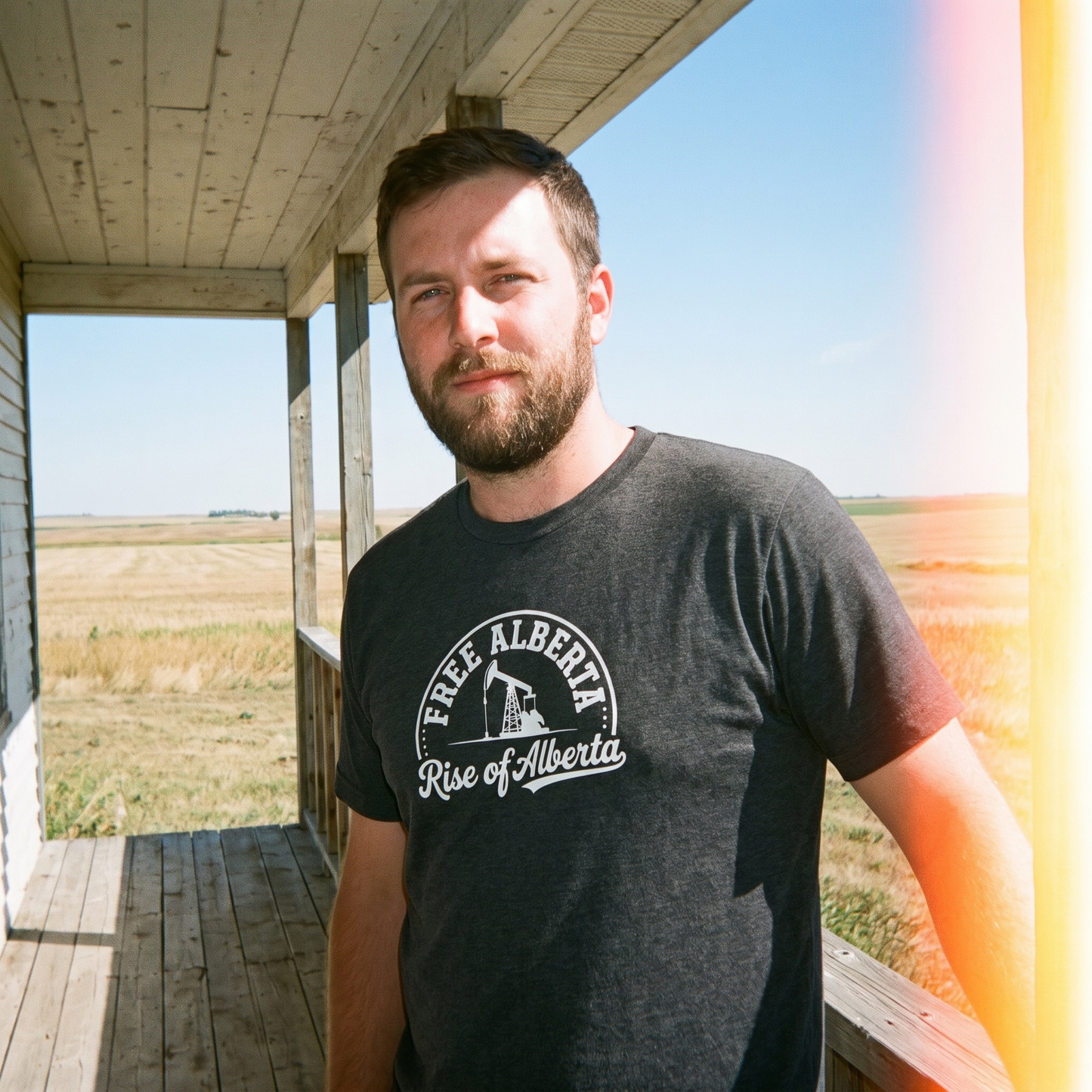 Free Alberta pumpjack tee dark grey heather porch lifestyle
