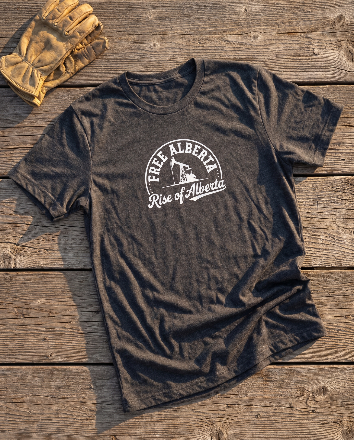 Free Alberta pumpjack tee dark grey heather flat lay barn wood