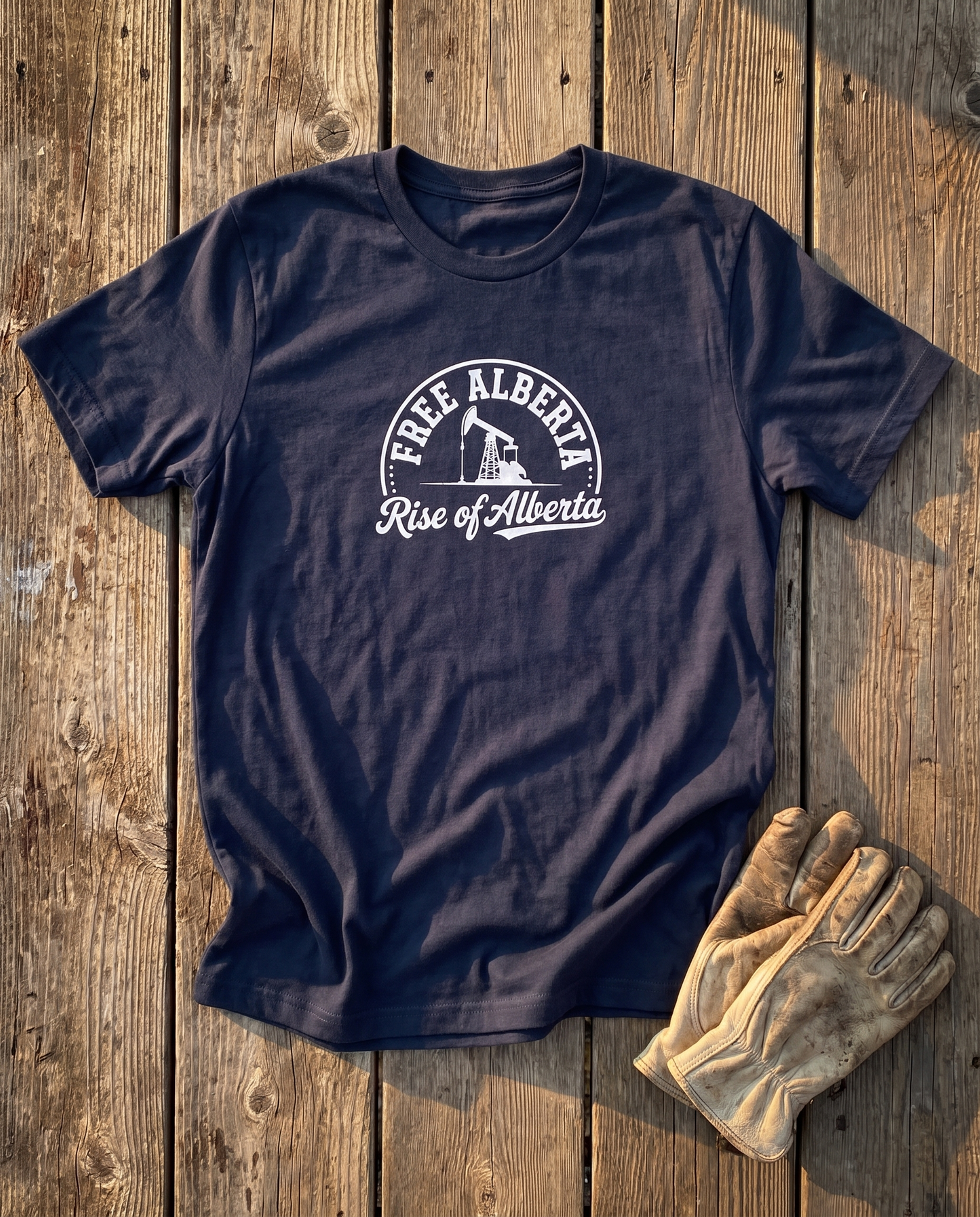 Free Alberta pumpjack tee navy flat lay barn wood