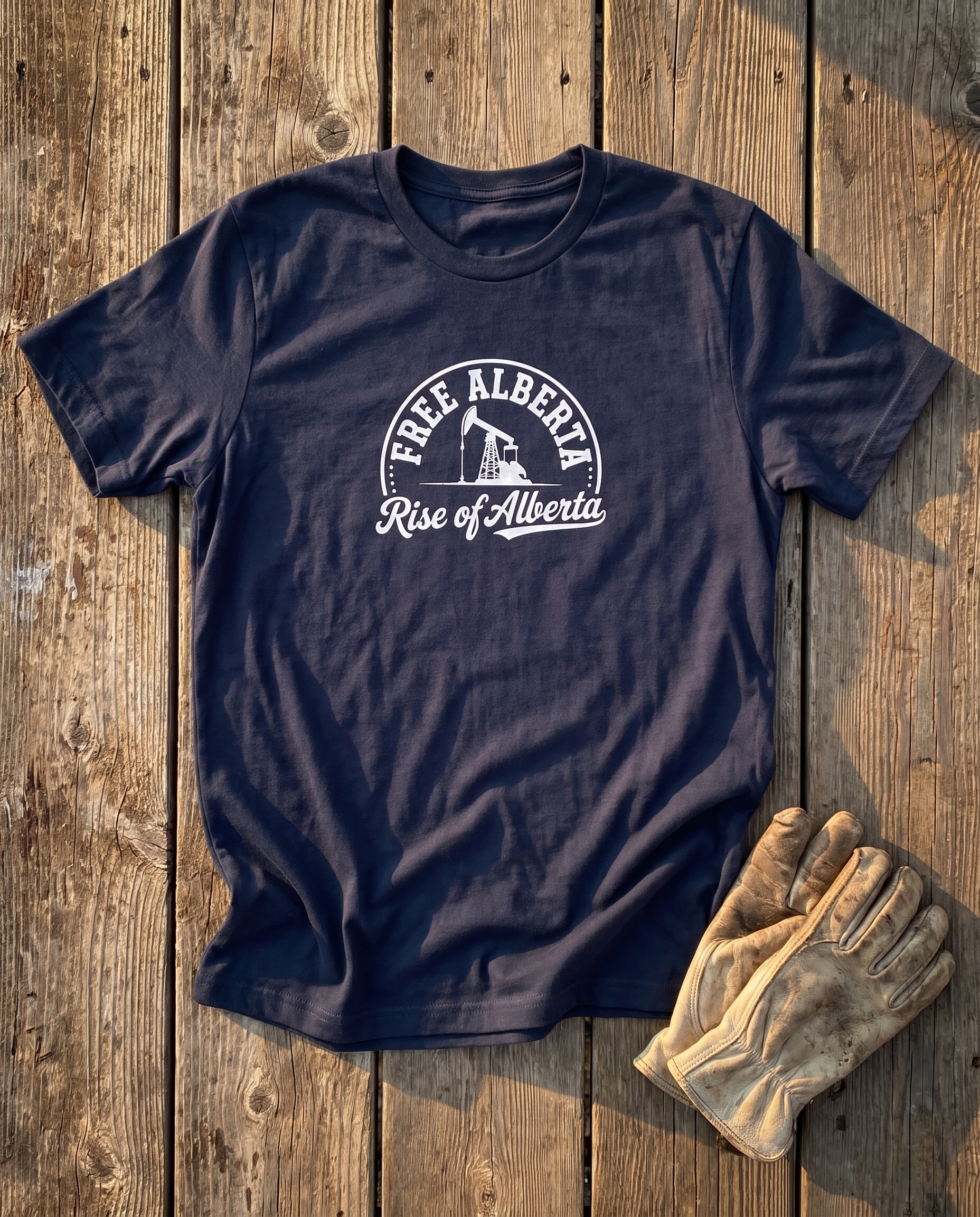 Free Alberta pumpjack tee navy flat lay barn wood