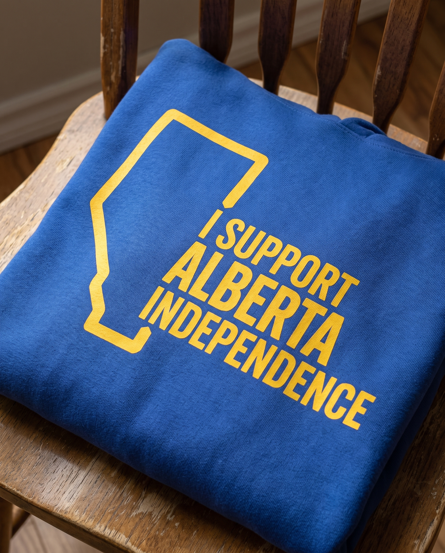Support Alberta Independence hoodie gold DTG print detail close-up