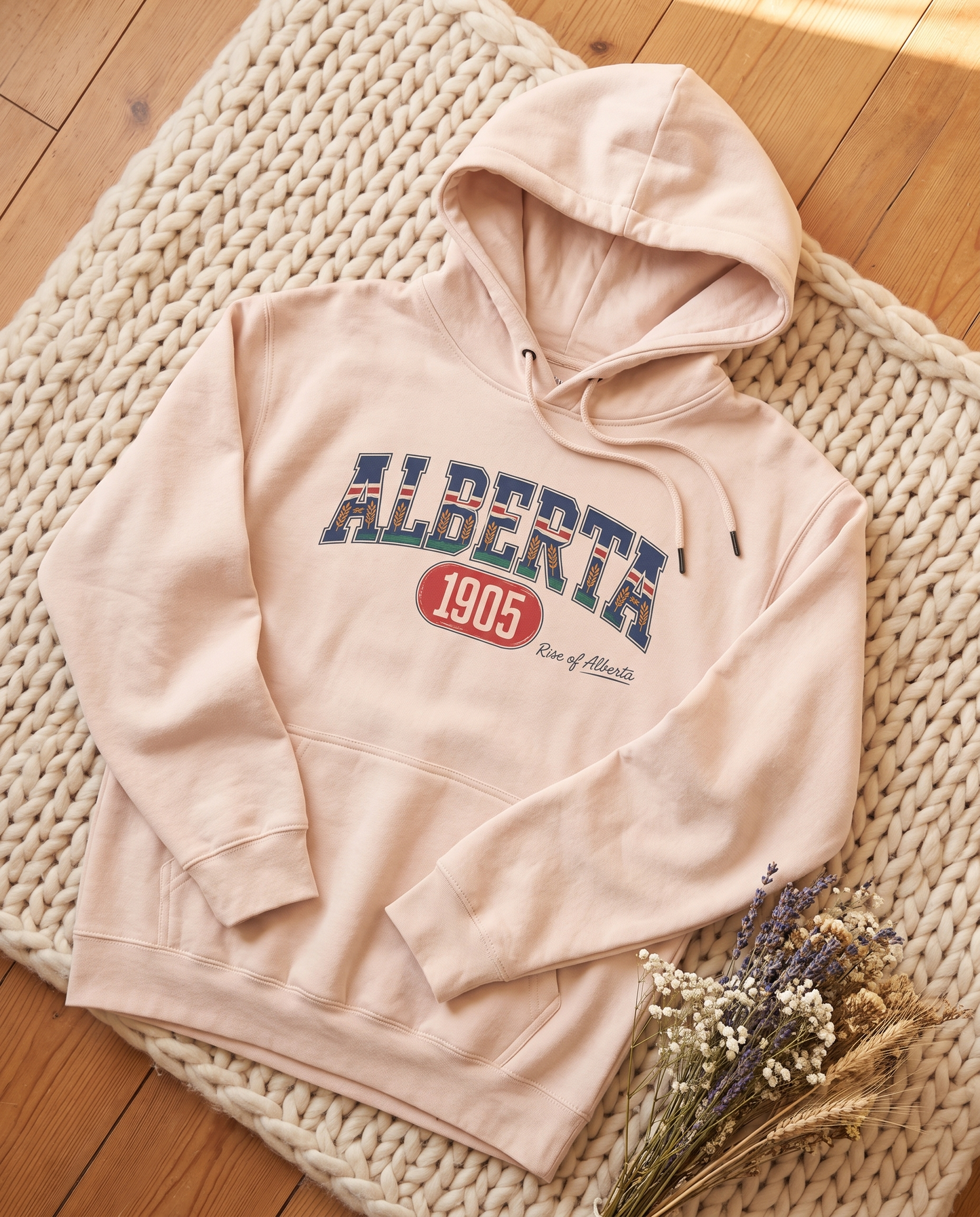 Alberta 1905 fleece hoodie pale pink flat lay on knit blanket