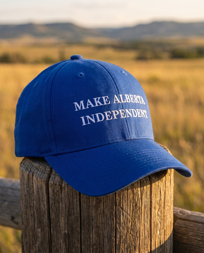 Make Alberta Independent embroidered cap royal blue on fence post