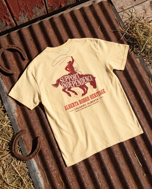 Stampede Rider Free Alberta tee butter back print on rusted corrugated steel