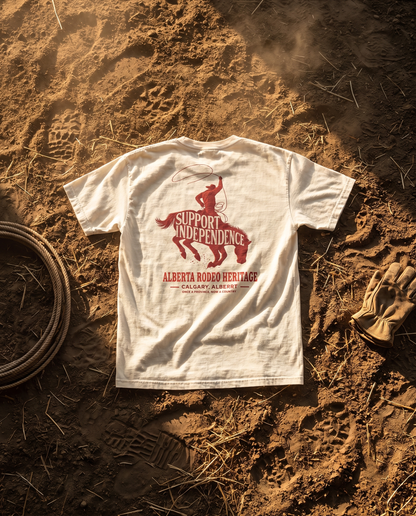 Stampede Rider Free Alberta tee ivory back print on rodeo arena dirt