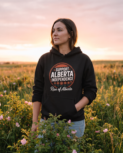 Wildrose Support Alberta Independence Hoodie worn in a field of wild roses at sunset
