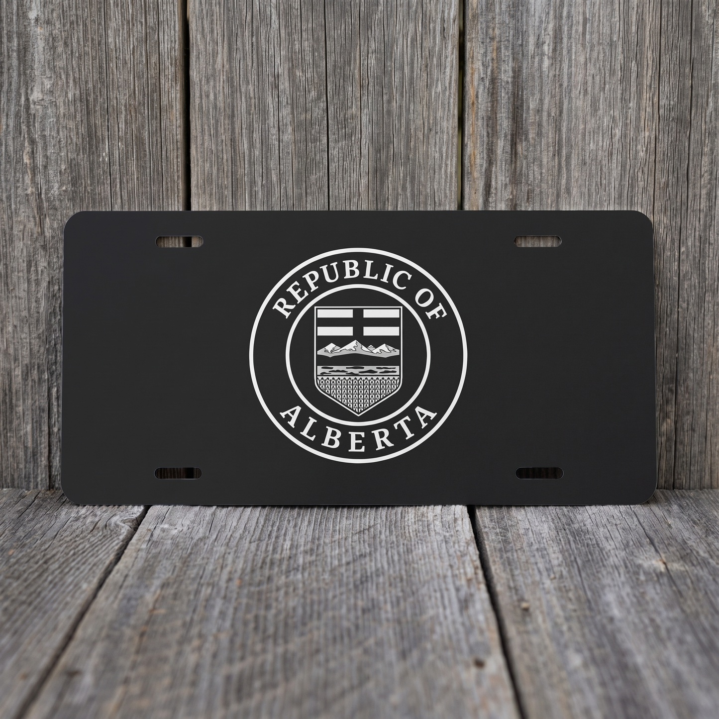 Black Republic of Alberta Seal vanity plate against weathered barn board