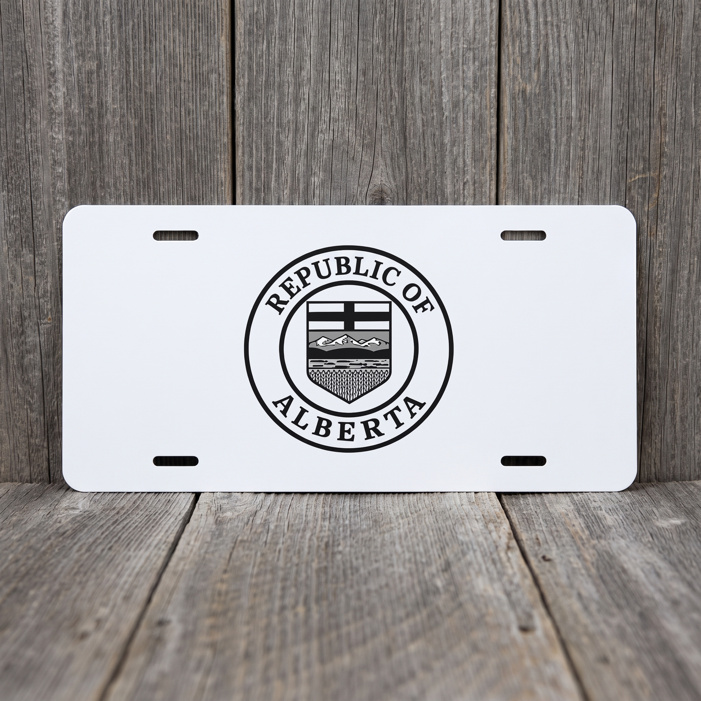 White Republic of Alberta vanity plate against weathered barn board