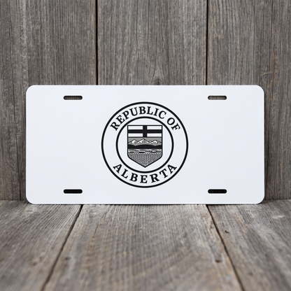 White Republic of Alberta vanity plate against weathered barn board
