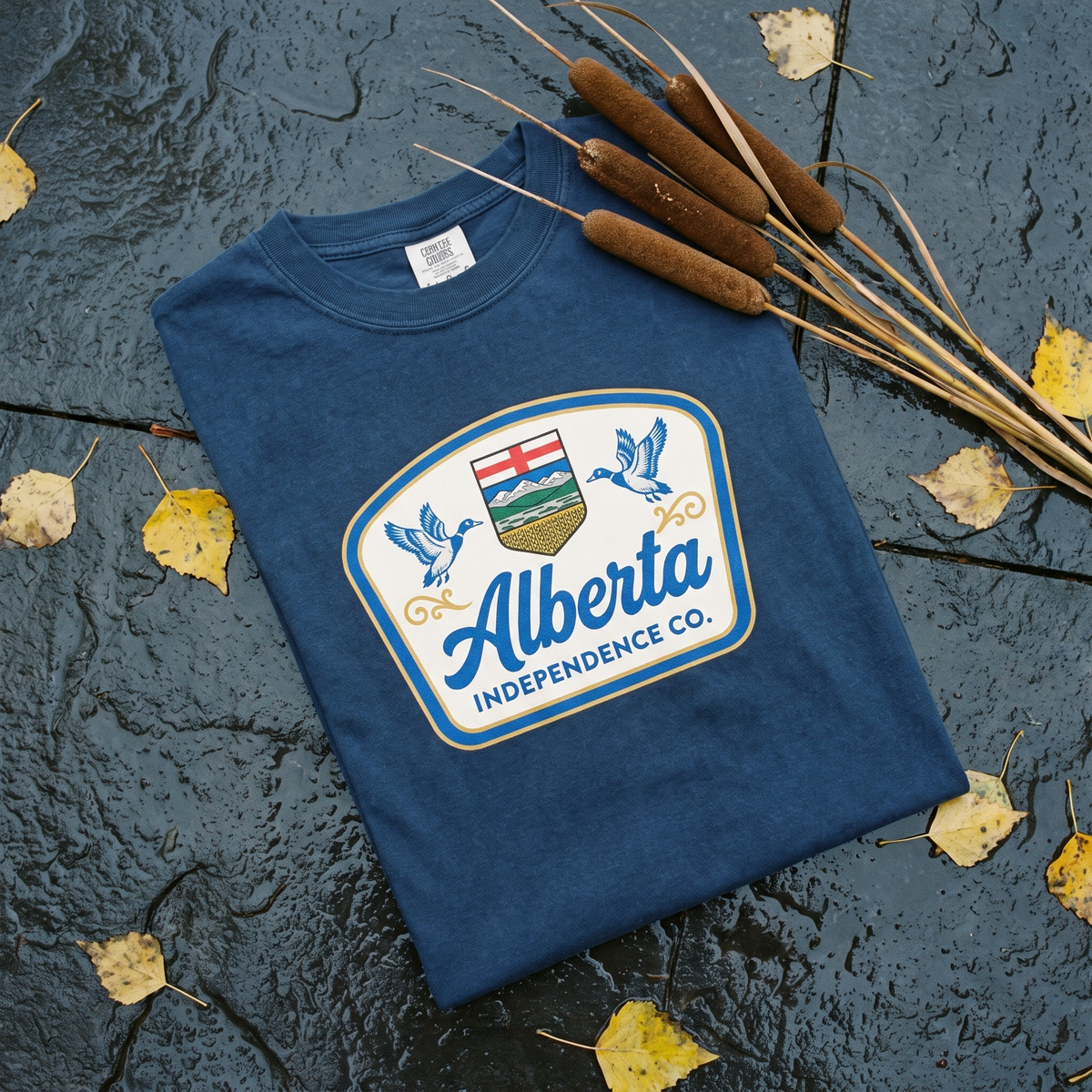 Heritage Tee in True Navy, folded flat lay on slate