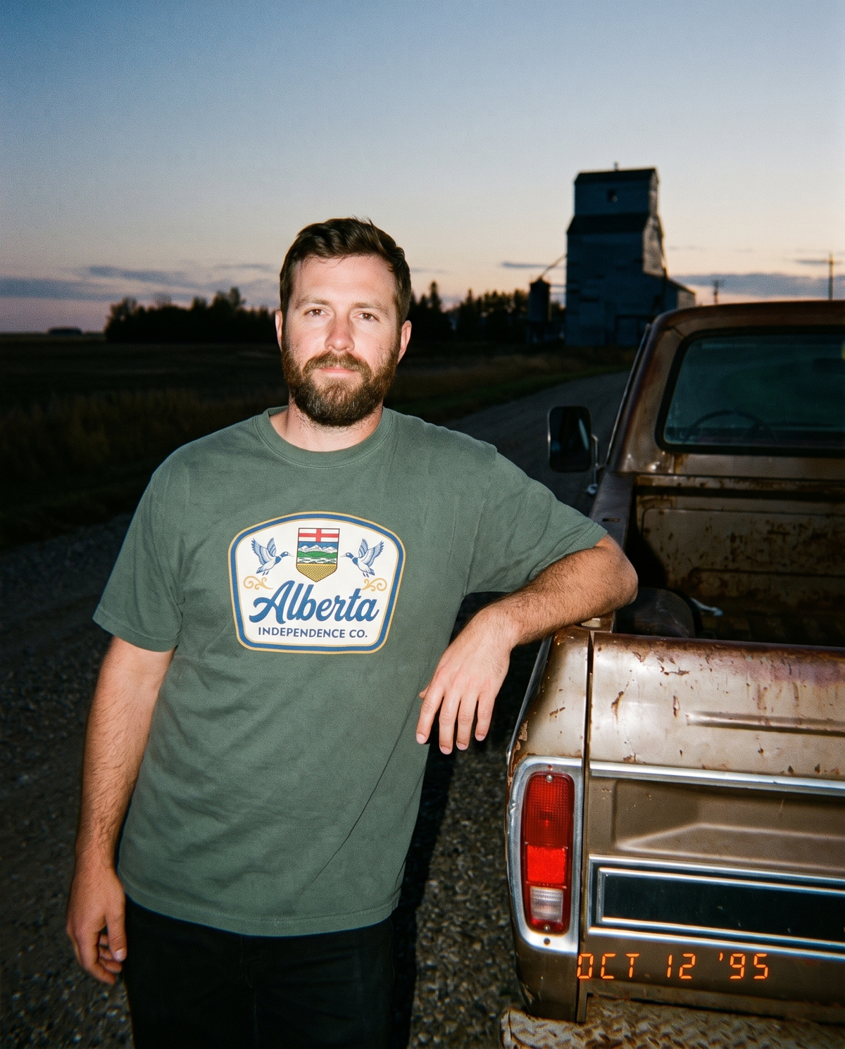 Heritage Tee in Blue Spruce worn at a truck tailgate