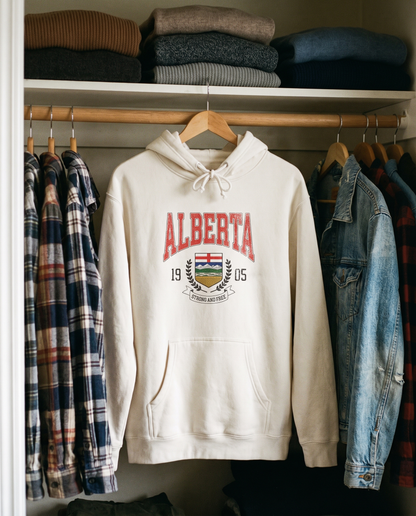 Alberta Coat of Arms Hoodie hanging in a closet