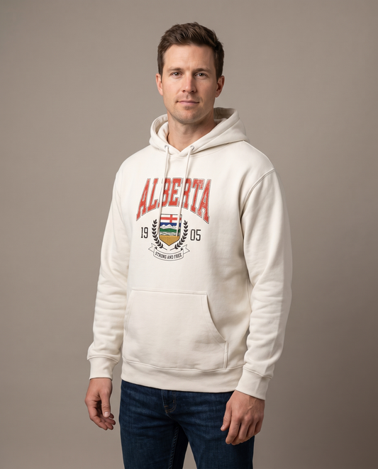 Man wearing the Alberta Coat of Arms Hoodie in bone cream